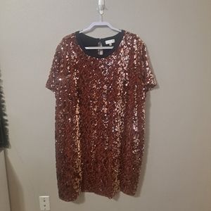 3x gold sequined dress.